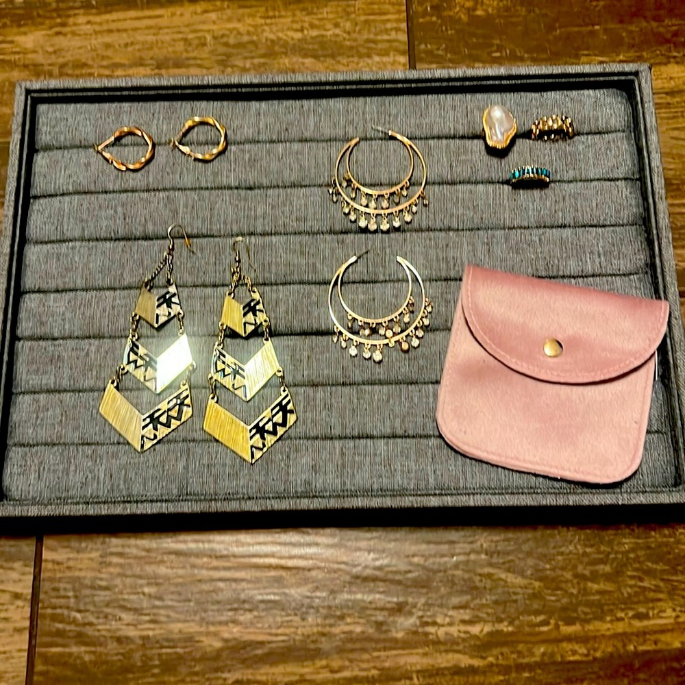 Gold earring and ring combo. Small and large hoops with statement earrings.